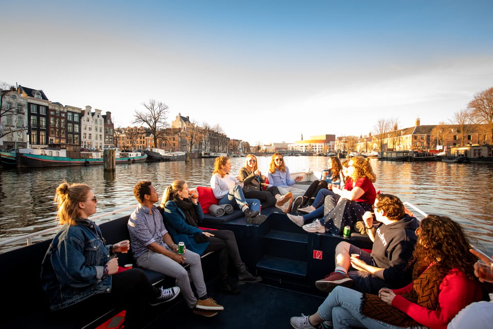 Small-Group Walking Tour with Amsterdam Canal Cruise - Zeedijk and Nieuwmarkt: markets, streets, and moral complexity
