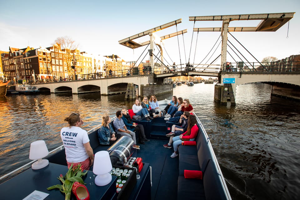 Small-Group Walking Tour with Amsterdam Canal Cruise - The 1-hour cruise that shows the seven bridges and Amstel connection